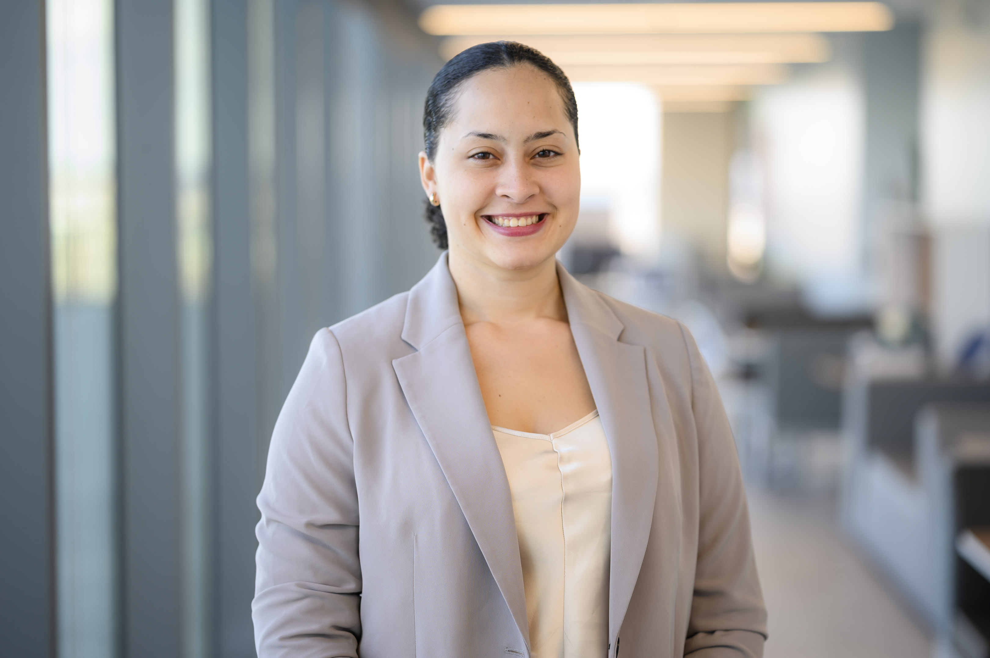 person posing for professional photo in hallway