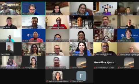 screenshot of a zoom class with multiple people smiling