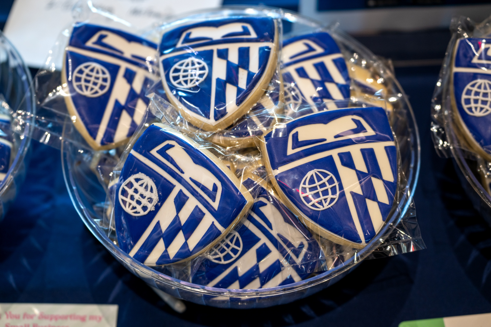 basket of cookies with the johns hopkins carey business school shield on them