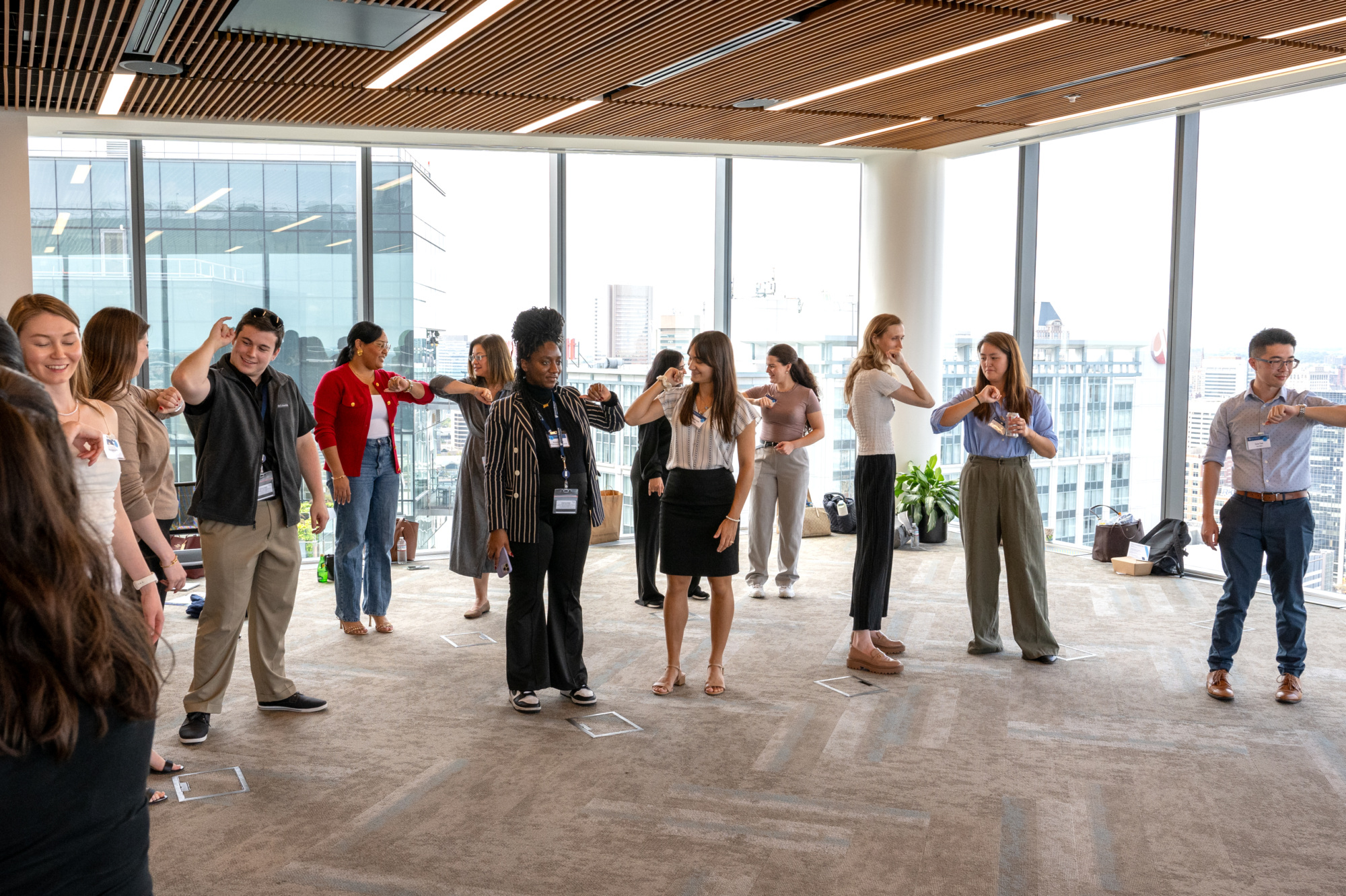 people standing in a room chatting with each other