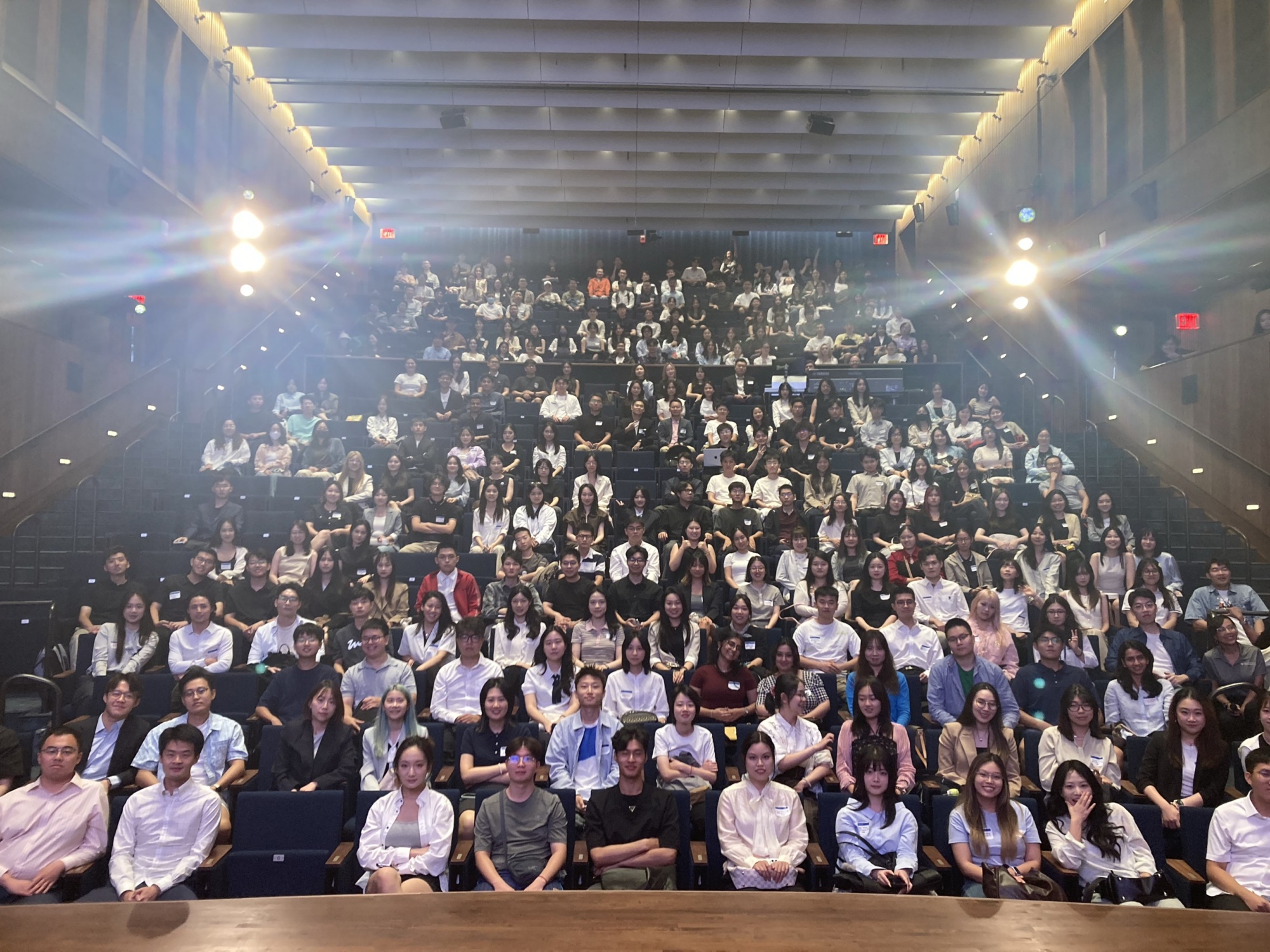 photo of people in an audience sitting down