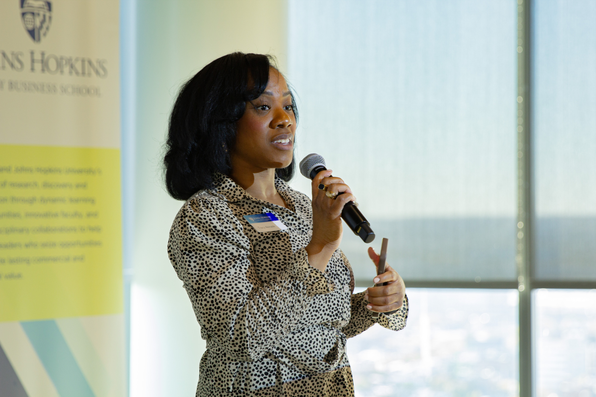 one person standing and talking into a microphone